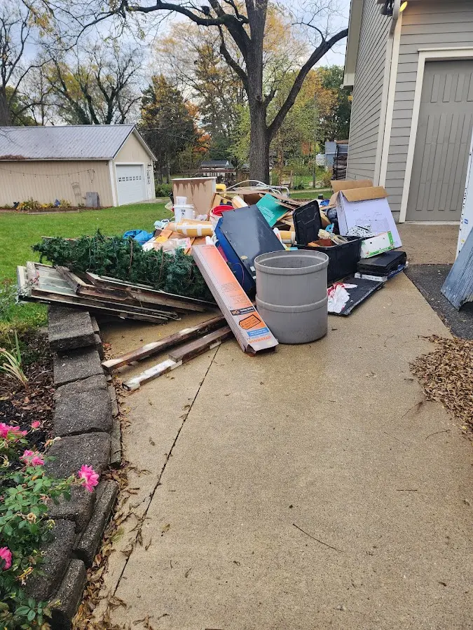 Dumpster being loaded with debris for 30 Yard Dumpster Rental in Waterford
